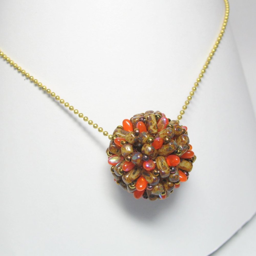 Handwoven Fall color beaded bead pendant